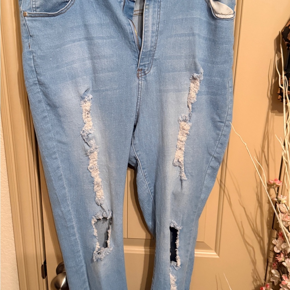 Fashion Nova say less to distressed jeans in light blue wash 2x